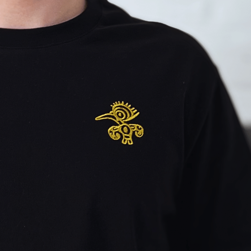 Mio Mio T-Shirt Schwarz Schwarzes Mio Mio T-Shirt mit Gold eingraviertem Tukan